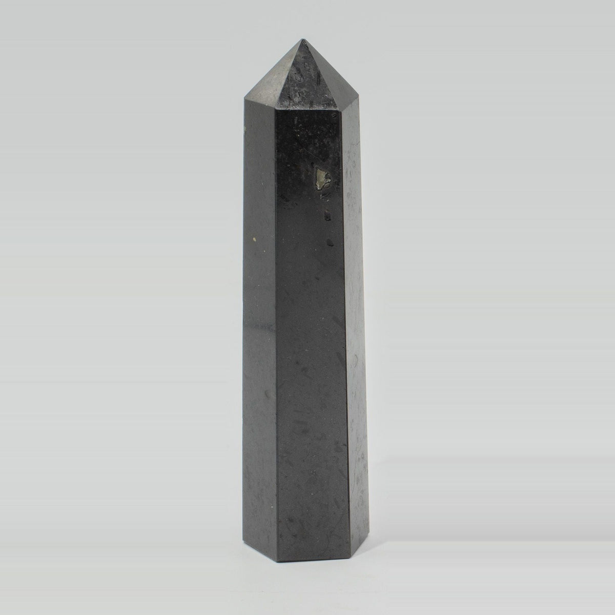 Black Tourmaline Crystal Obelisk Point Large - Six Face Polished Gemstone Tower, pictured on its own