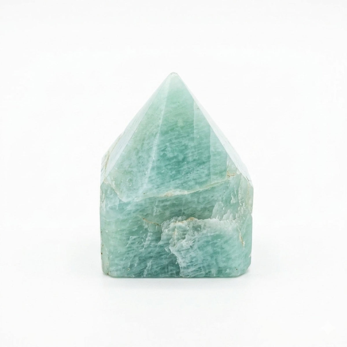 A polished green amazonite crystal point standing on cotton canvas - view 8