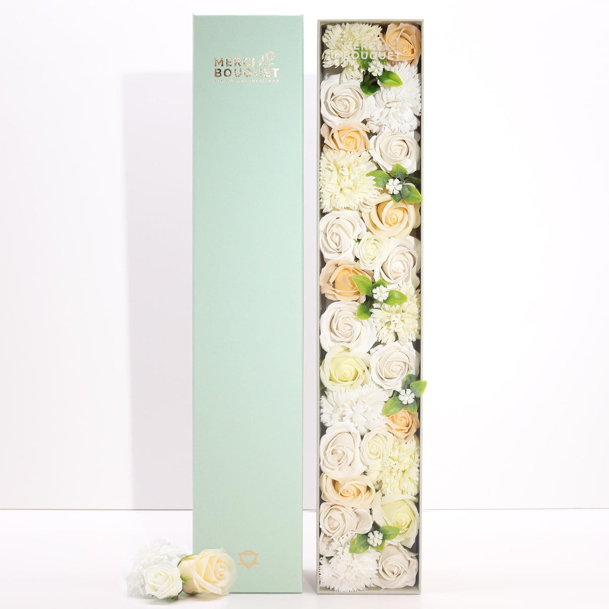 Long box of white and ivory soap roses lying open on cotton canvas - view 3