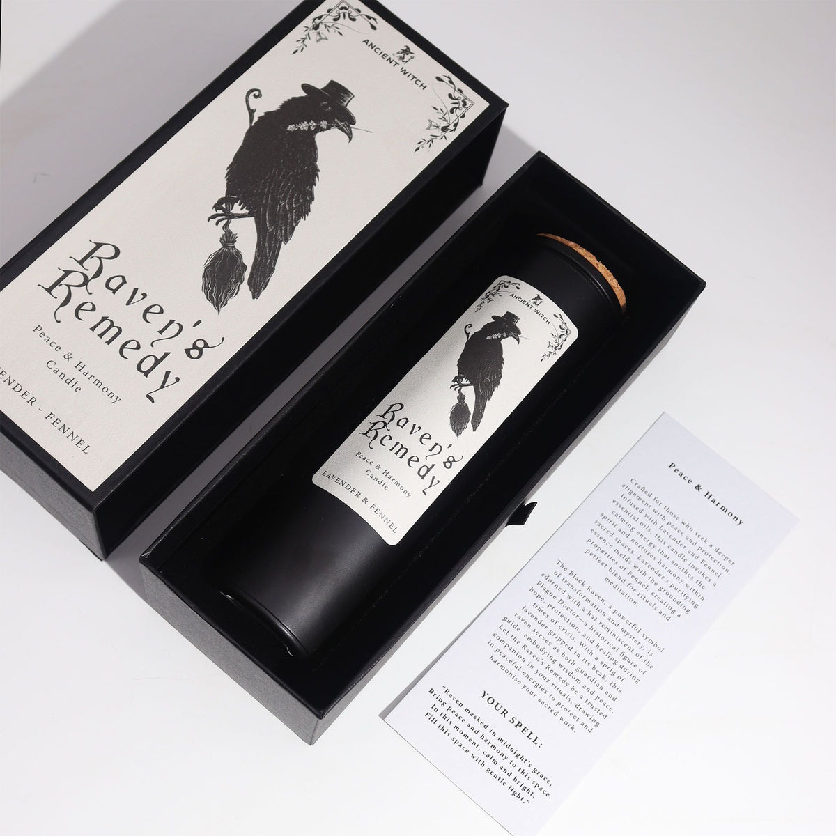 Raven's Remedy candle and spell card in its open gift box
