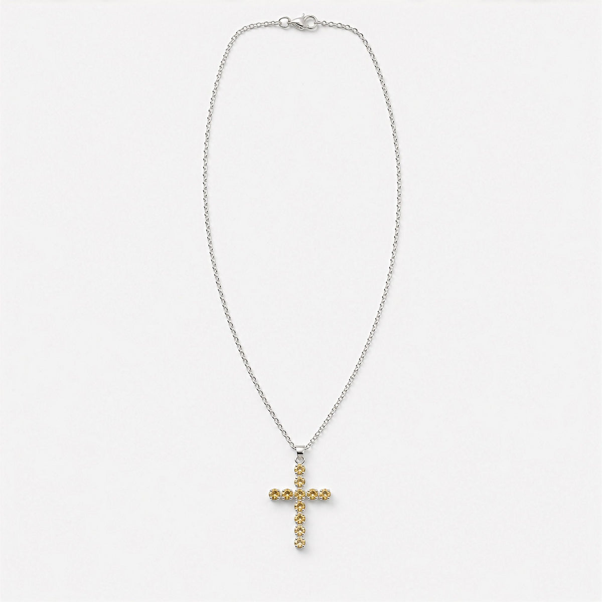 Silver-plated crucifix pendant set with golden citrine-coloured stones, on linen - view 7