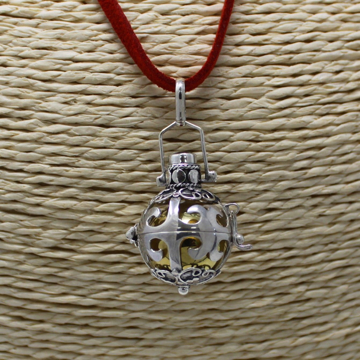 Silver angel bell pendant in the Magic design on a neck cord - view 2