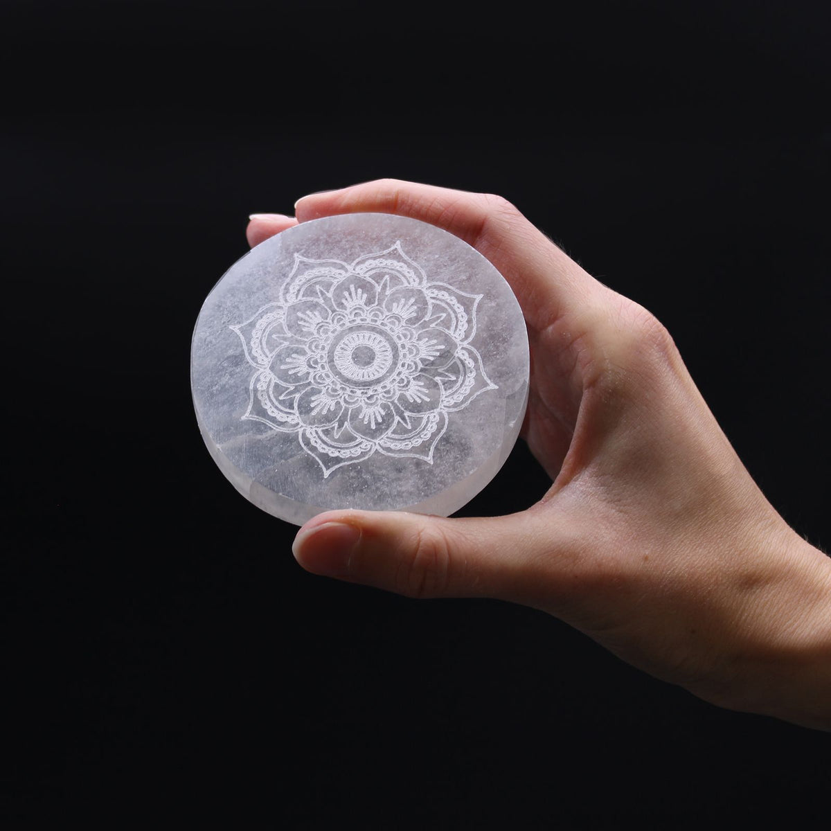 Small round selenite charging plate engraved with a mandala