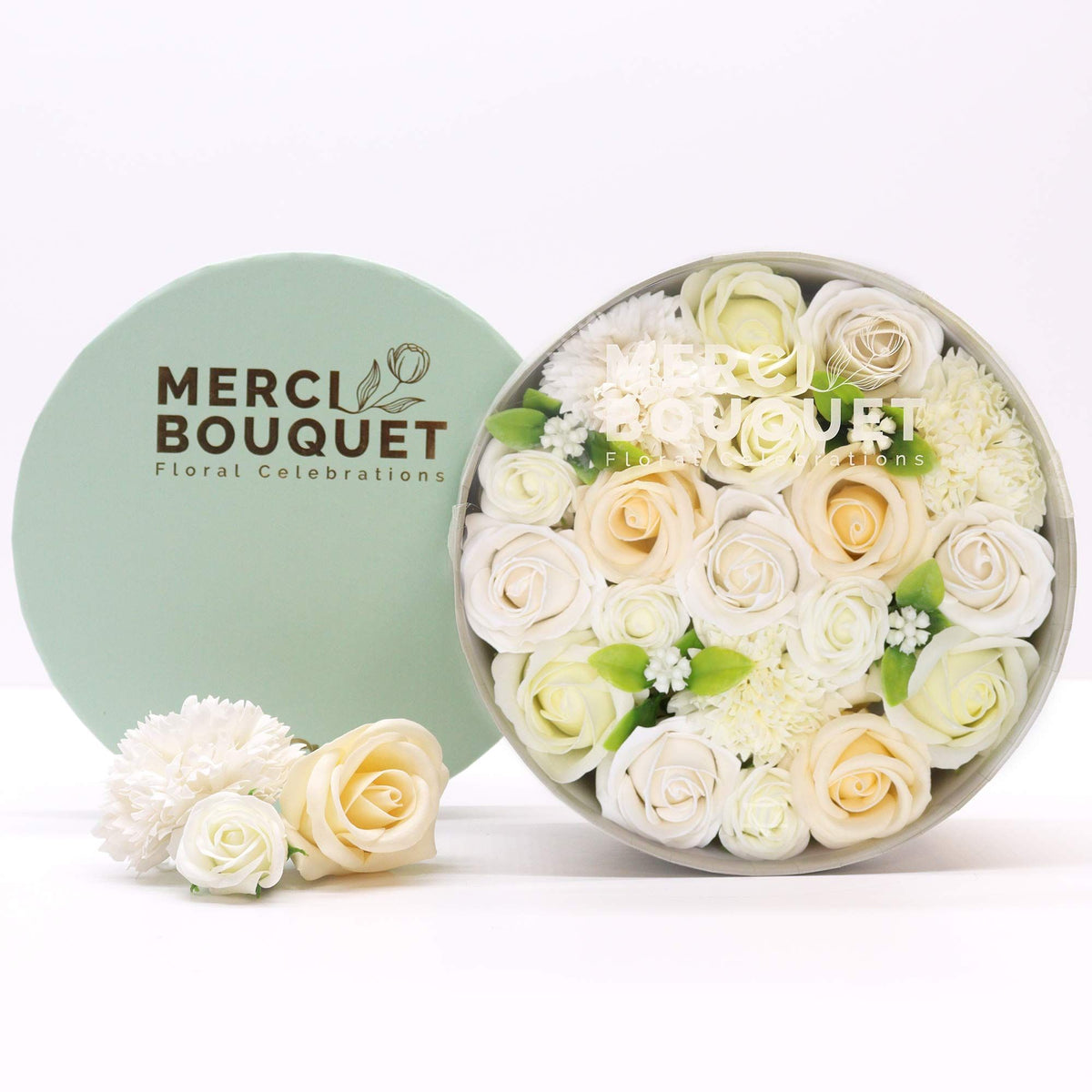 Round box packed with white and ivory soap roses, seen from above on cotton-rag paper - view 3