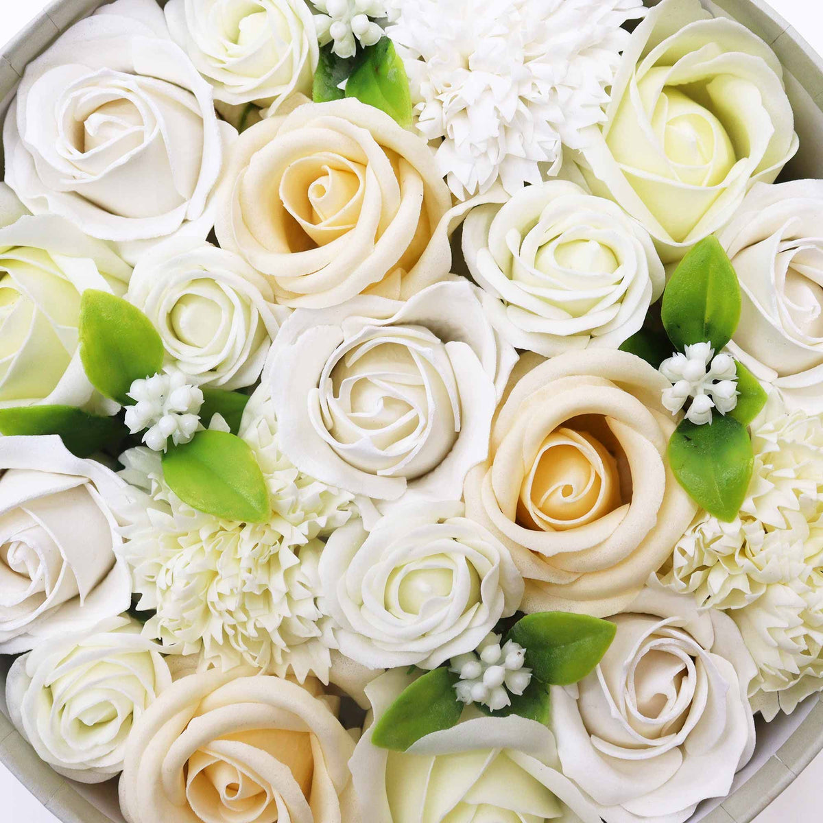 Round box packed with white and ivory soap roses, seen from above on cotton-rag paper - view 5