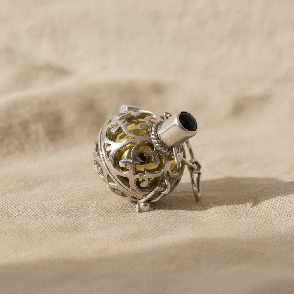 Silver angel bell pendant Night-time with black stone on natural linen