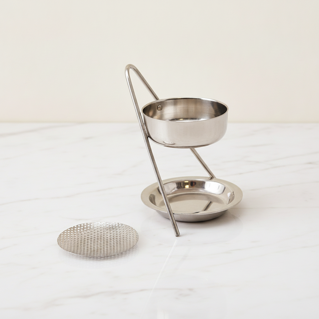 Plated brass incense warmer with mesh dish and tealight tray, on rumpled linen - view 2