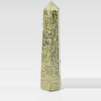 Epidote Crystal Obelisk Point - Six Face Polished Gemstone Tower, pictured on its own