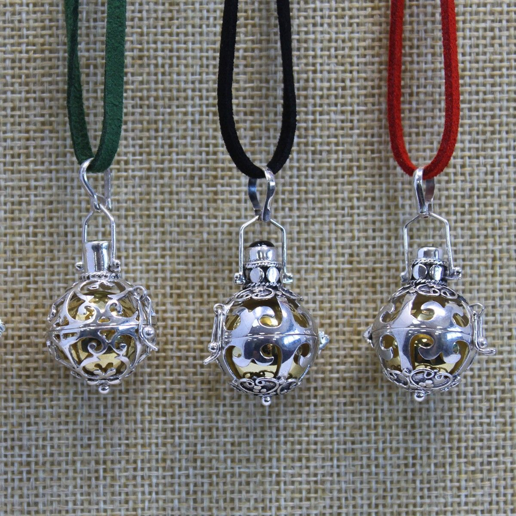 Silver angel bells shown on three cord colours