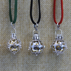 Silver angel bells shown on three cord colours