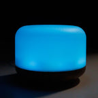 Squat white pod aroma diffuser on a wood-effect base - view 4