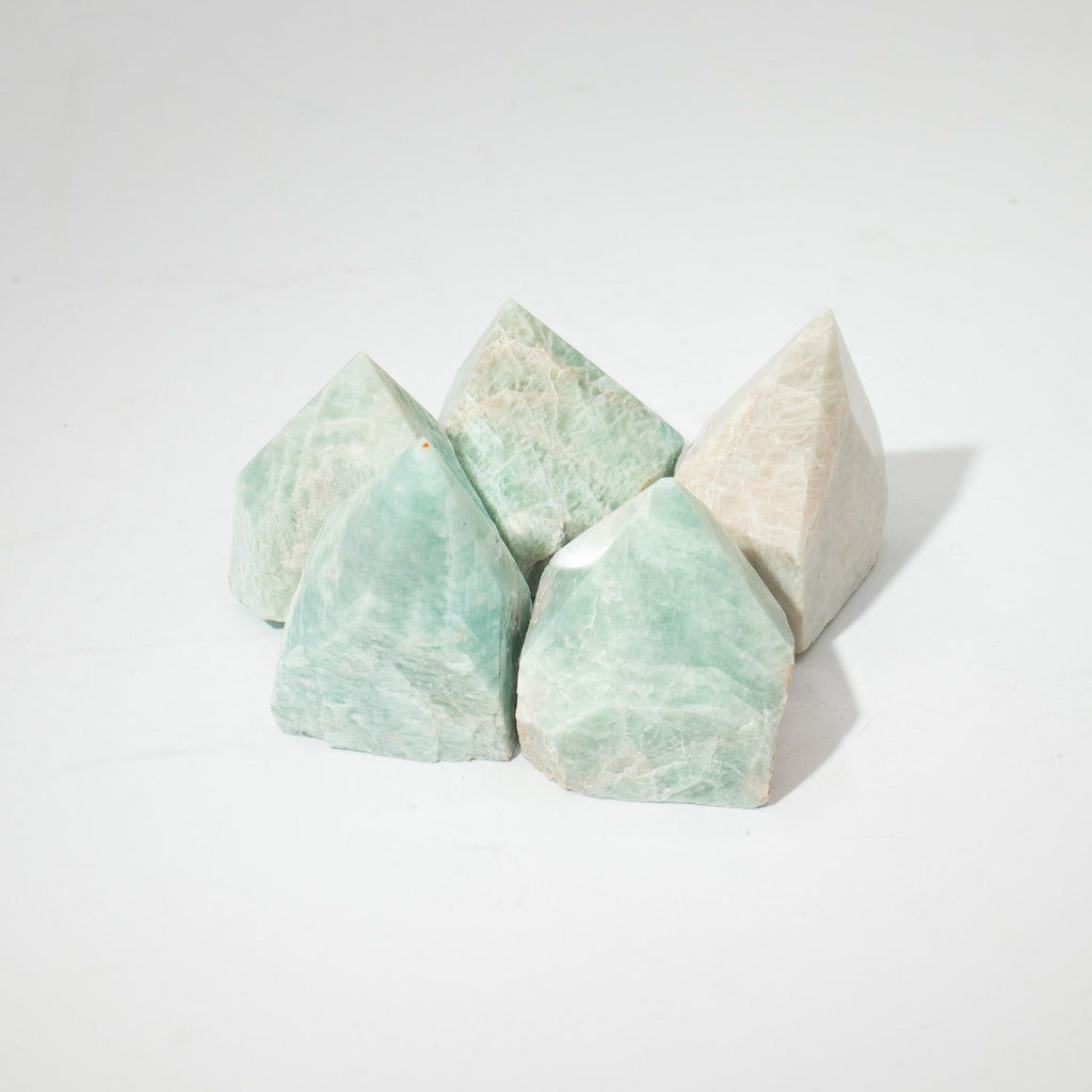 A polished green amazonite crystal point standing on cotton canvas - view 5