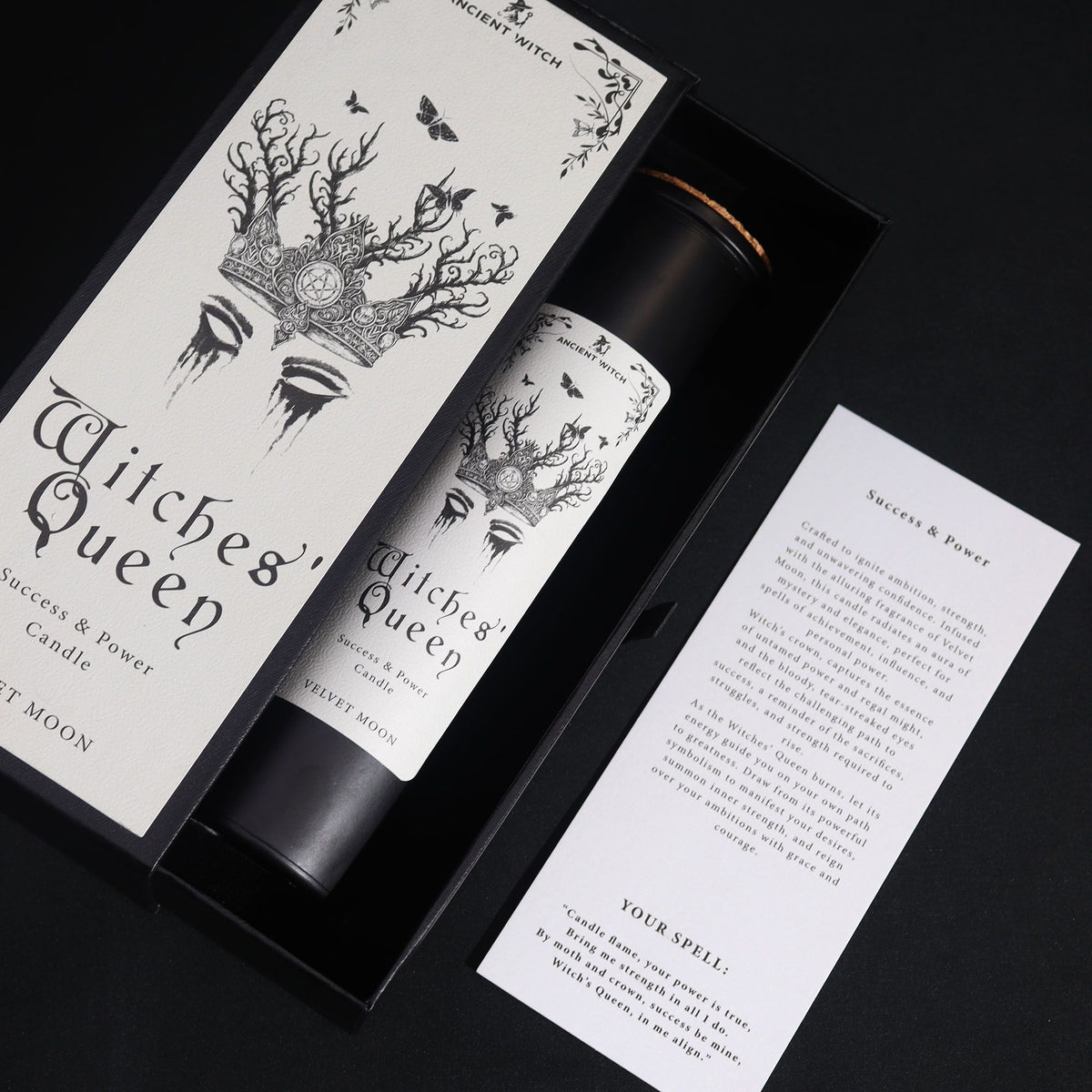 Black Witches' Queen candle tube beside its illustrated box, on cotton canvas - view 6