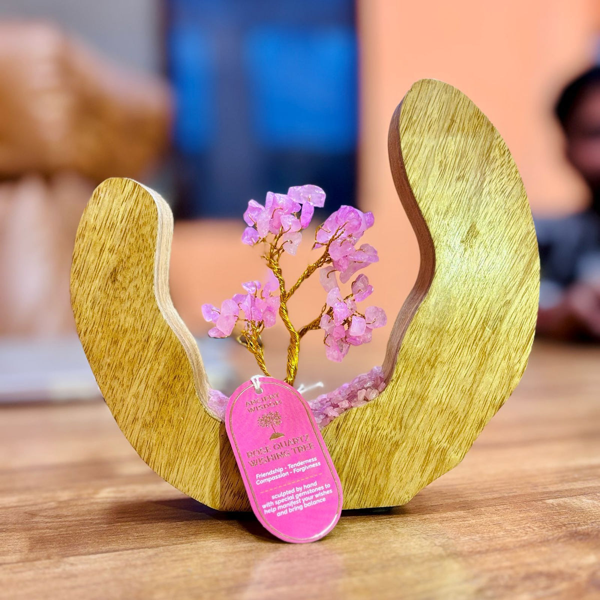 Rose quartz chip tree set inside an open mango wood ring