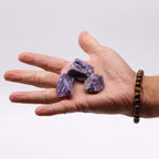 A spread of rough amethyst chunks in deep purple on cotton canvas - view 5