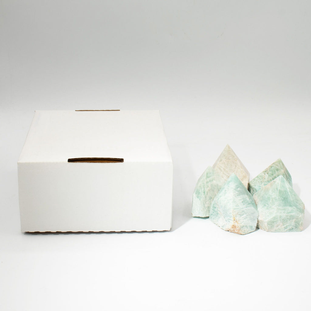 A polished green amazonite crystal point standing on cotton canvas - view 7