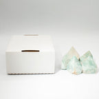 A polished green amazonite crystal point standing on cotton canvas - view 7