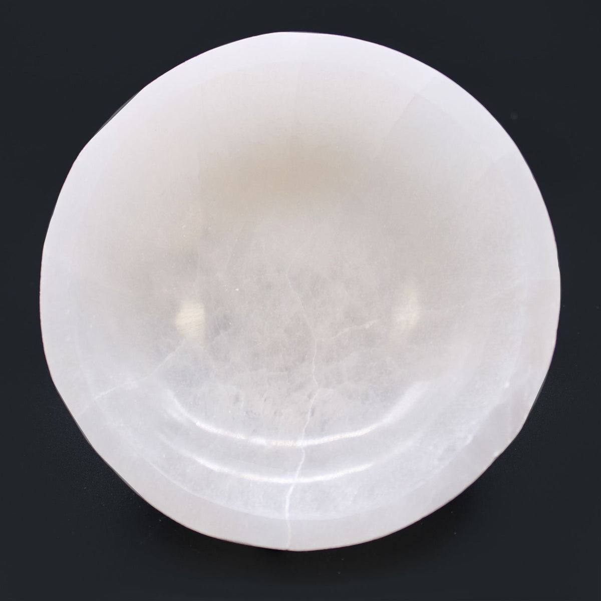 Round selenite bowl, polished inside with a raw white outer wall - view 4