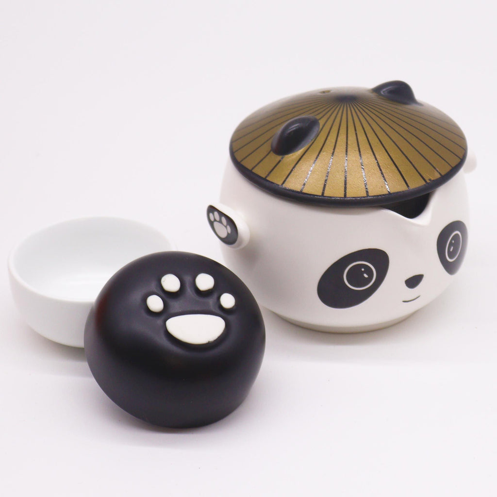 Panda-faced ceramic teapot with two cups and a golden hat lid, on cotton canvas - view 9