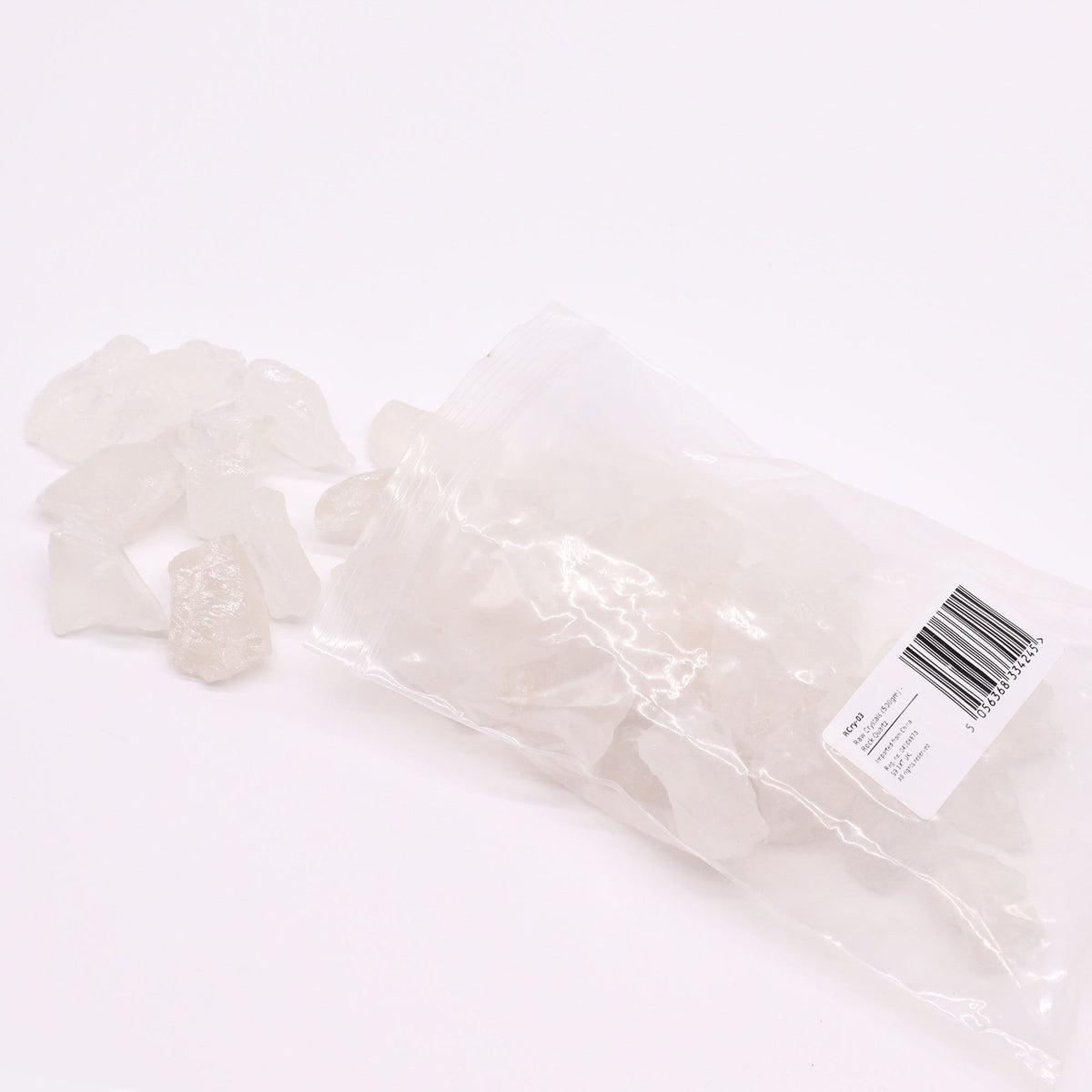 Rough milky quartz chunks piled on cotton canvas - view 4
