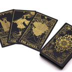 Gold foil tarot deck and guidebook in black and gold foil design