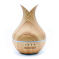 Light wood-effect aroma diffuser shaped like an open tulip