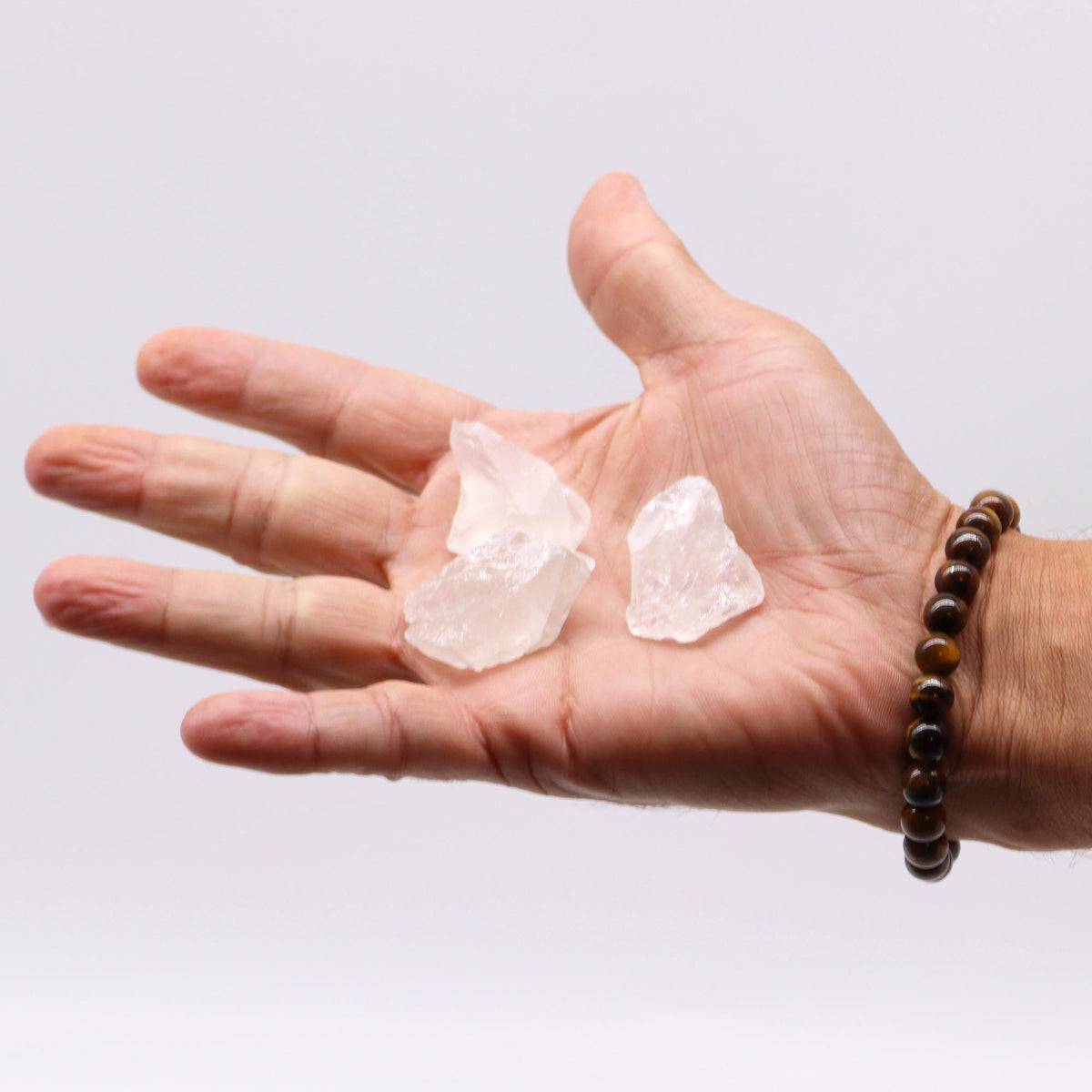 Rough milky quartz chunks piled on cotton canvas - view 5