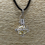 Silver angel bell pendant in the Night-time design on a neck cord - view 2