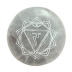 Set of seven small selenite charging plates, one engraved and coloured per chakra - view 5