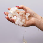 Clear quartz fairy lights held in a hand