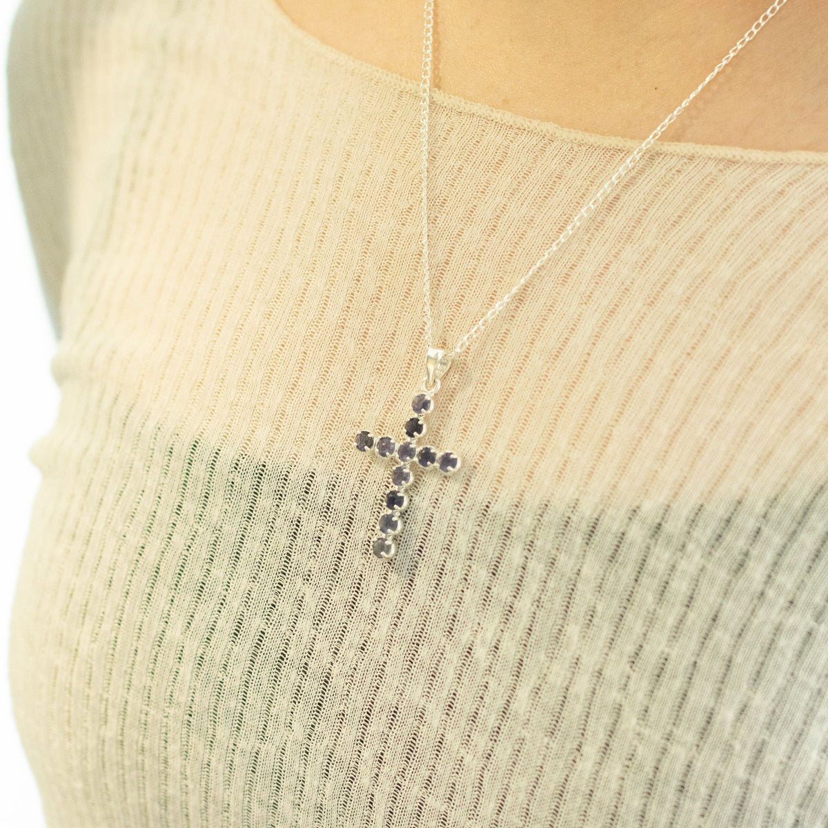 Silver-plated crucifix pendant set with deep purple stones, on linen - view 7