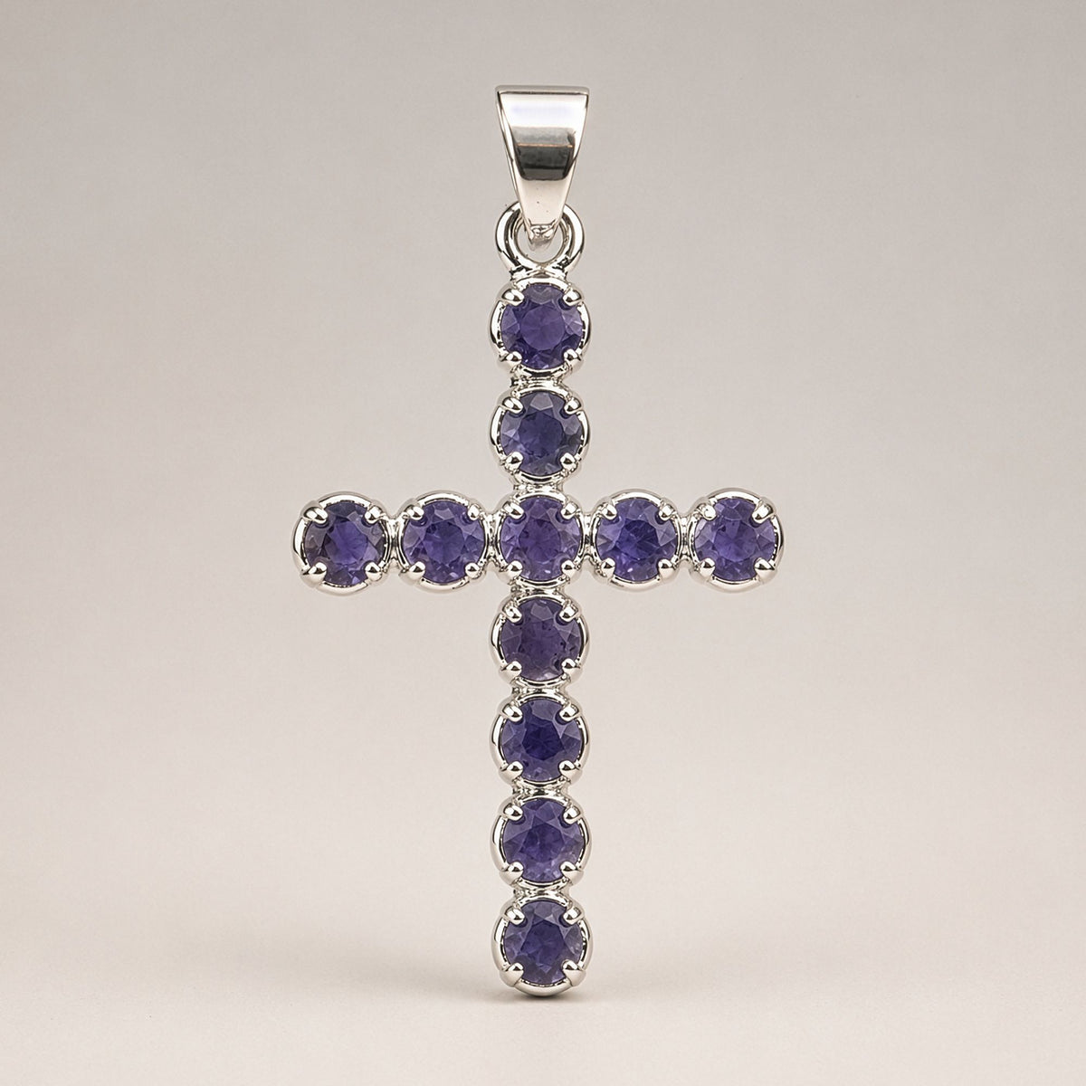 Silver-plated crucifix pendant set with deep purple stones, on linen - view 3