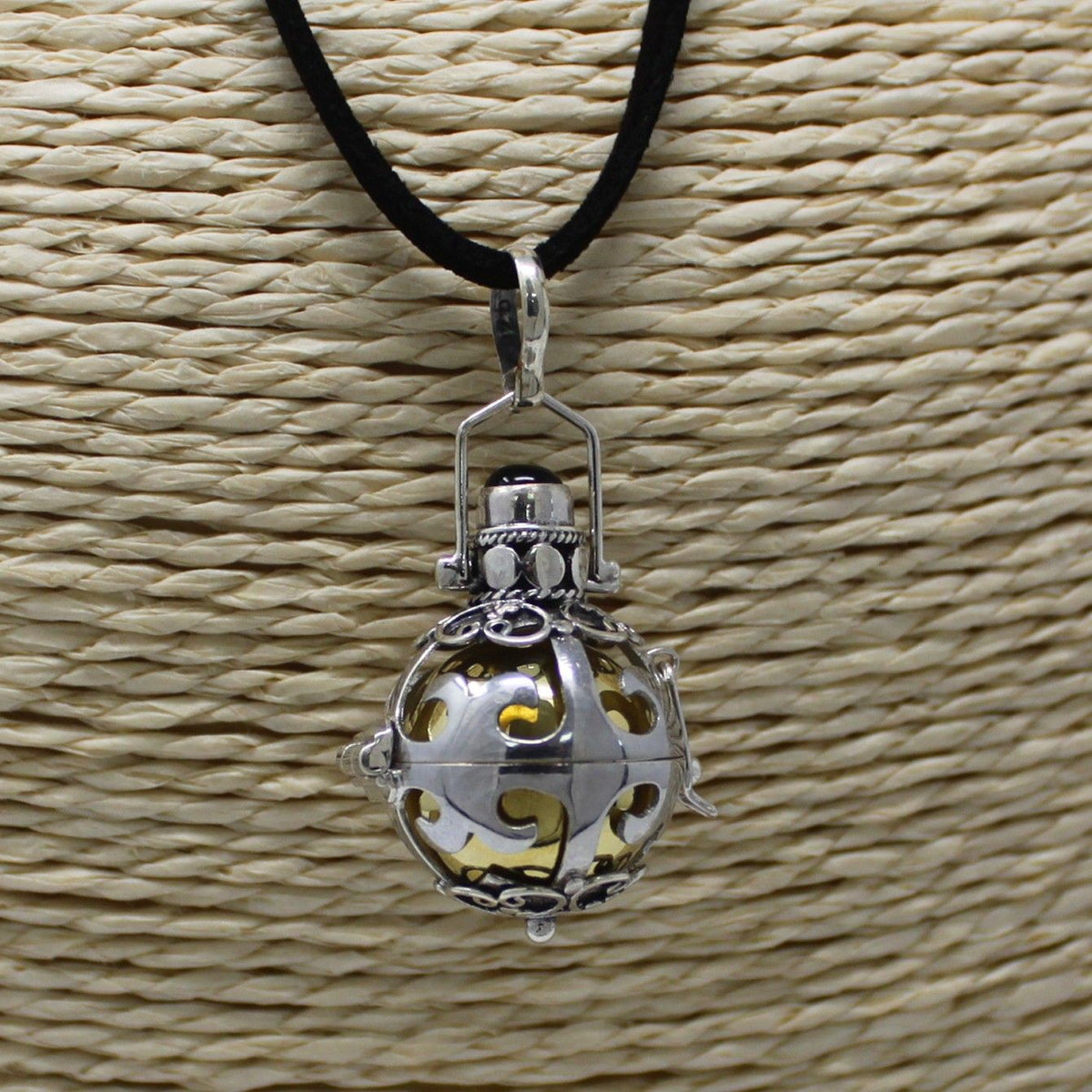 Silver angel bell pendant in the Dreams design on a neck cord - view 2