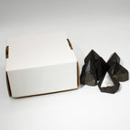 Polished black tourmaline crystal points grouped together on natural linen - view 7
