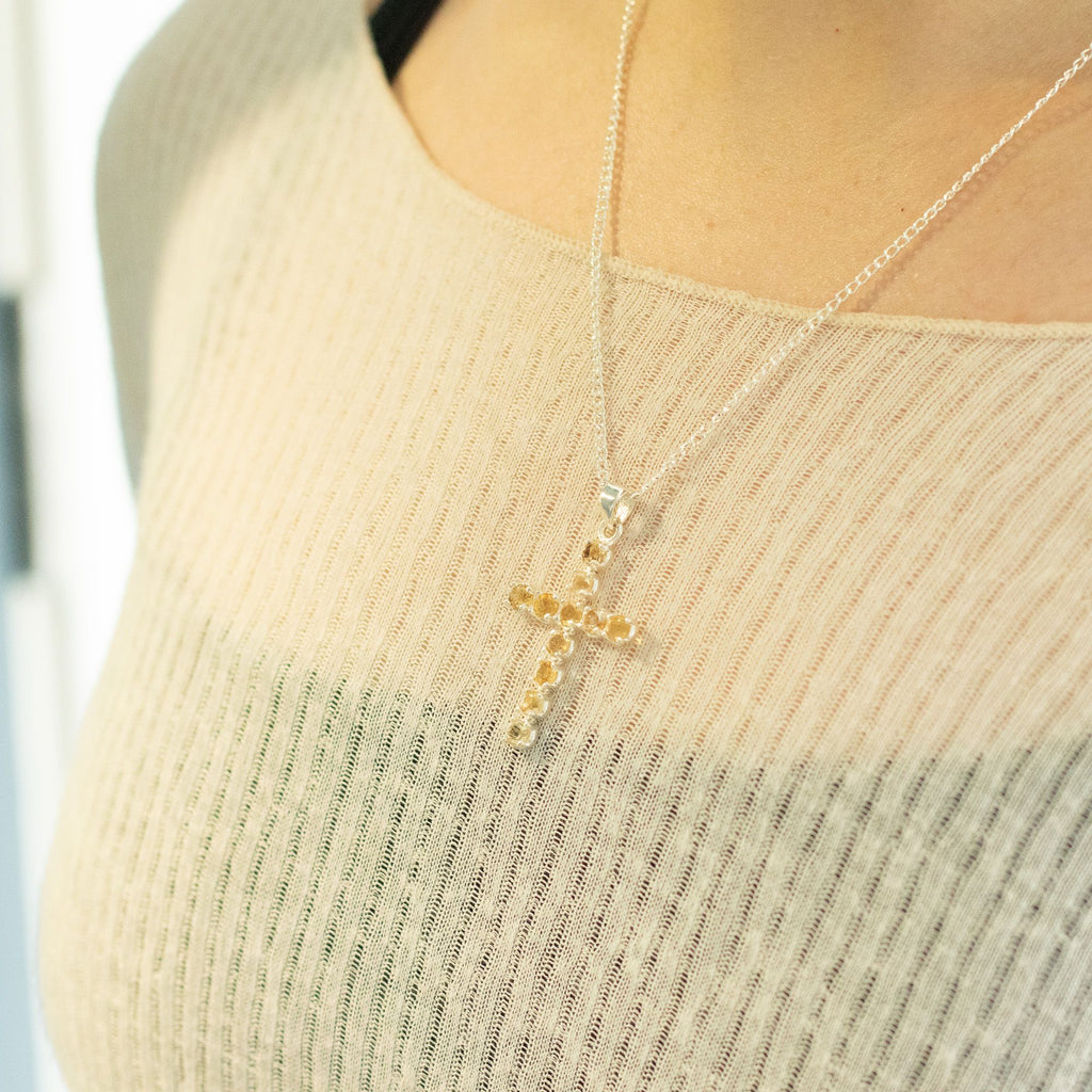 Silver-plated crucifix pendant set with golden citrine-coloured stones, on linen - view 4