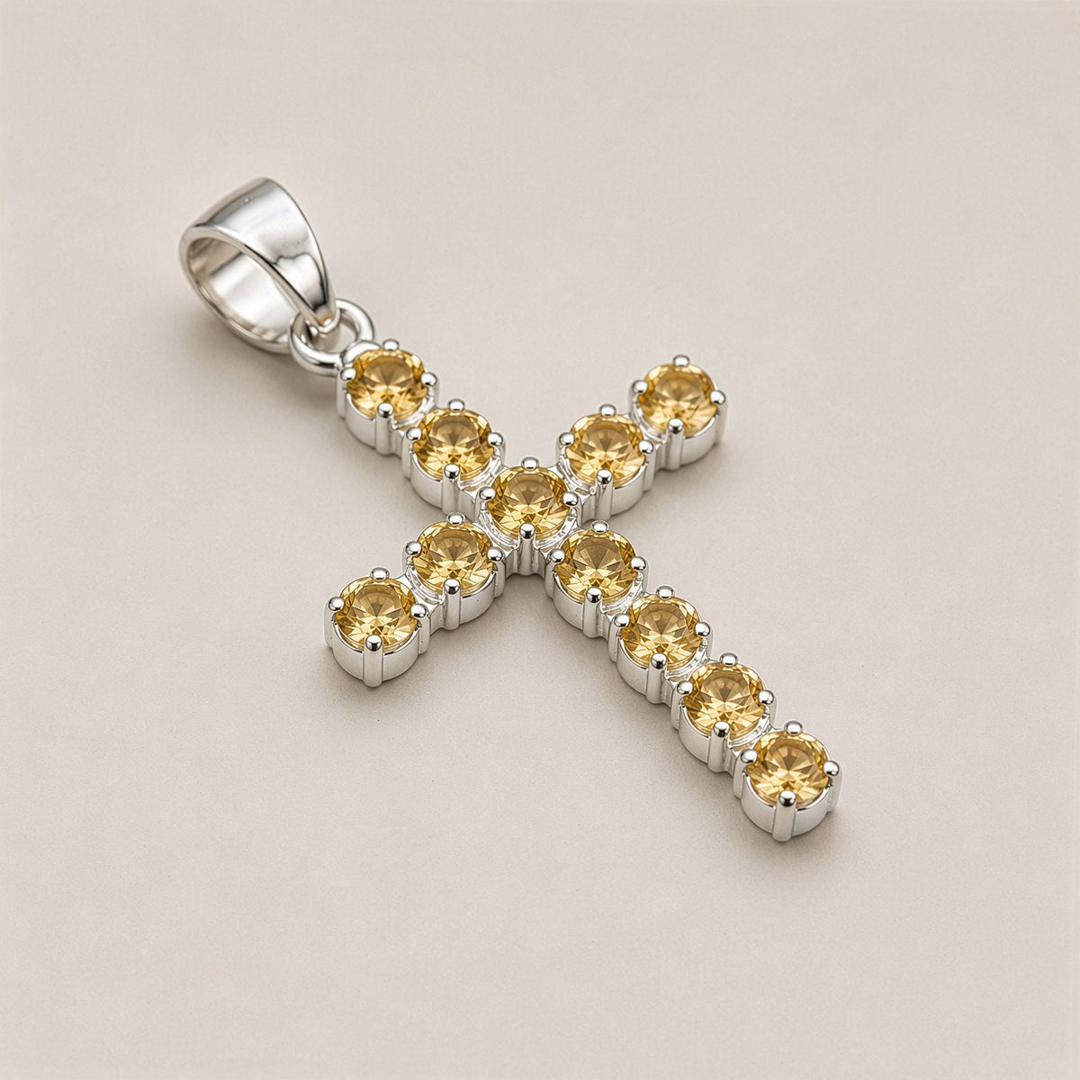 Silver-plated crucifix pendant set with golden citrine-coloured stones, on linen - view 3
