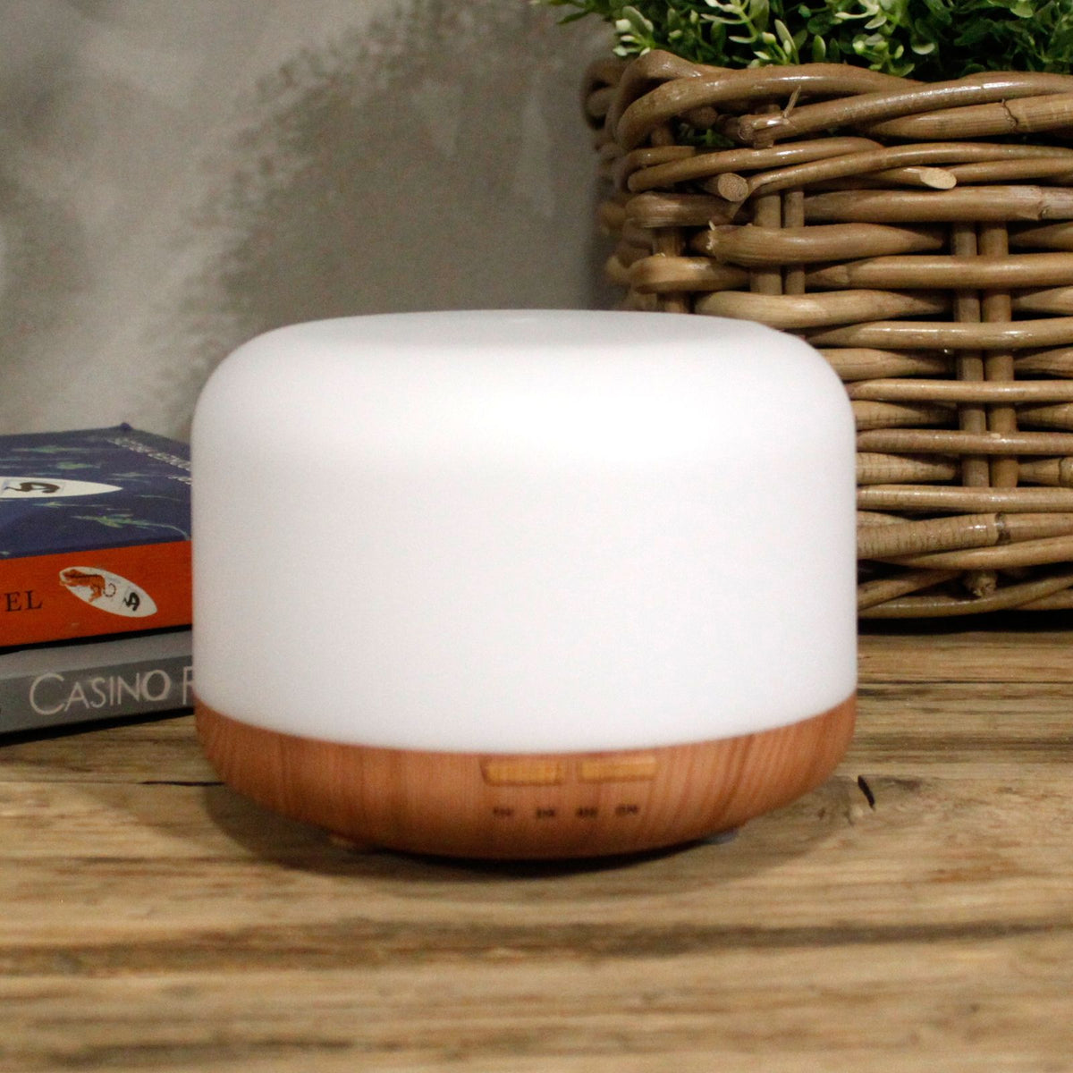 Squat white pod aroma diffuser on a wood-effect base - view 2