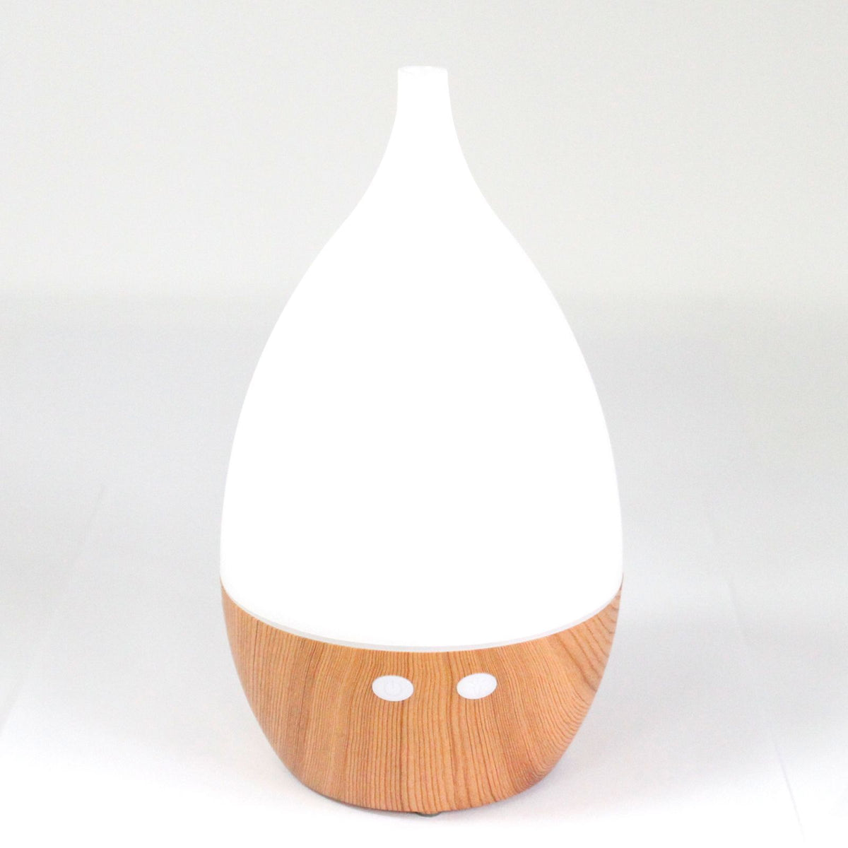 White teardrop ultrasonic aroma diffuser on a light wood base - view 4