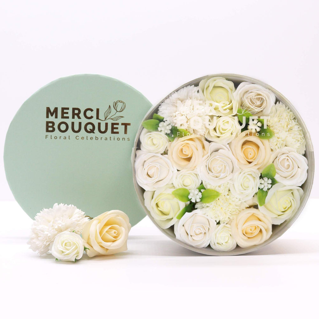 Round box packed with white and ivory soap roses, seen from above on cotton-rag paper - view 3
