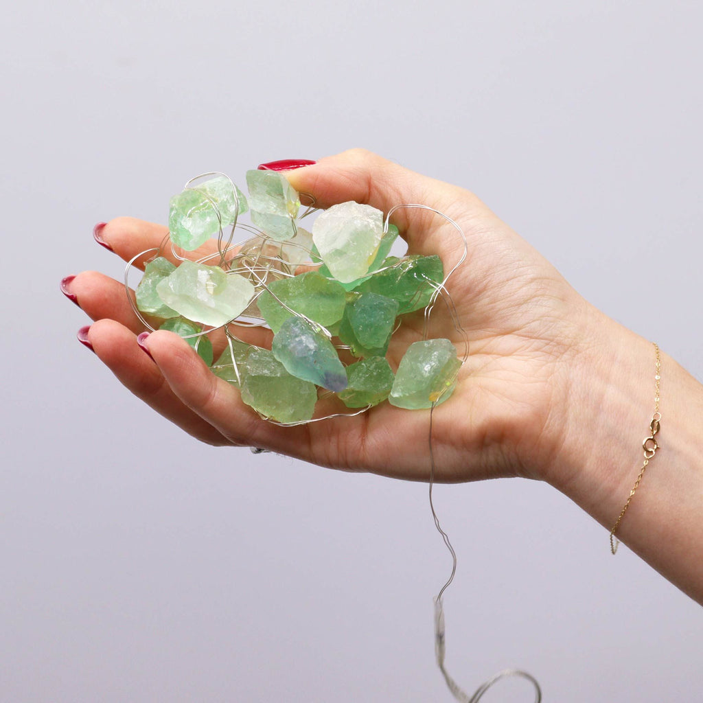 Green crystal jade fairy lights held in a hand