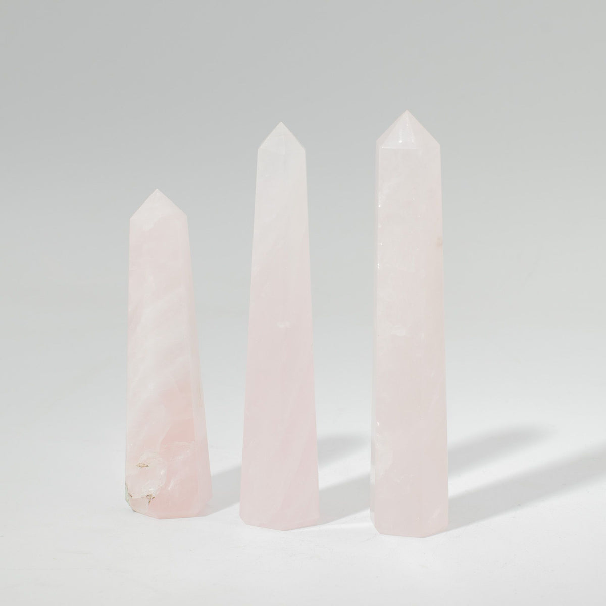 Polished rose quartz obelisk point, a six faced pale pink crystal tower - view 4