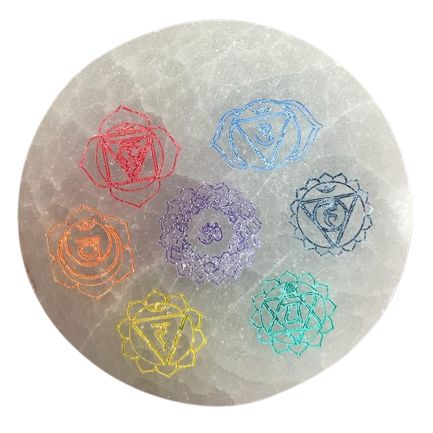 Small round selenite charging plate with the seven chakra symbols in colour