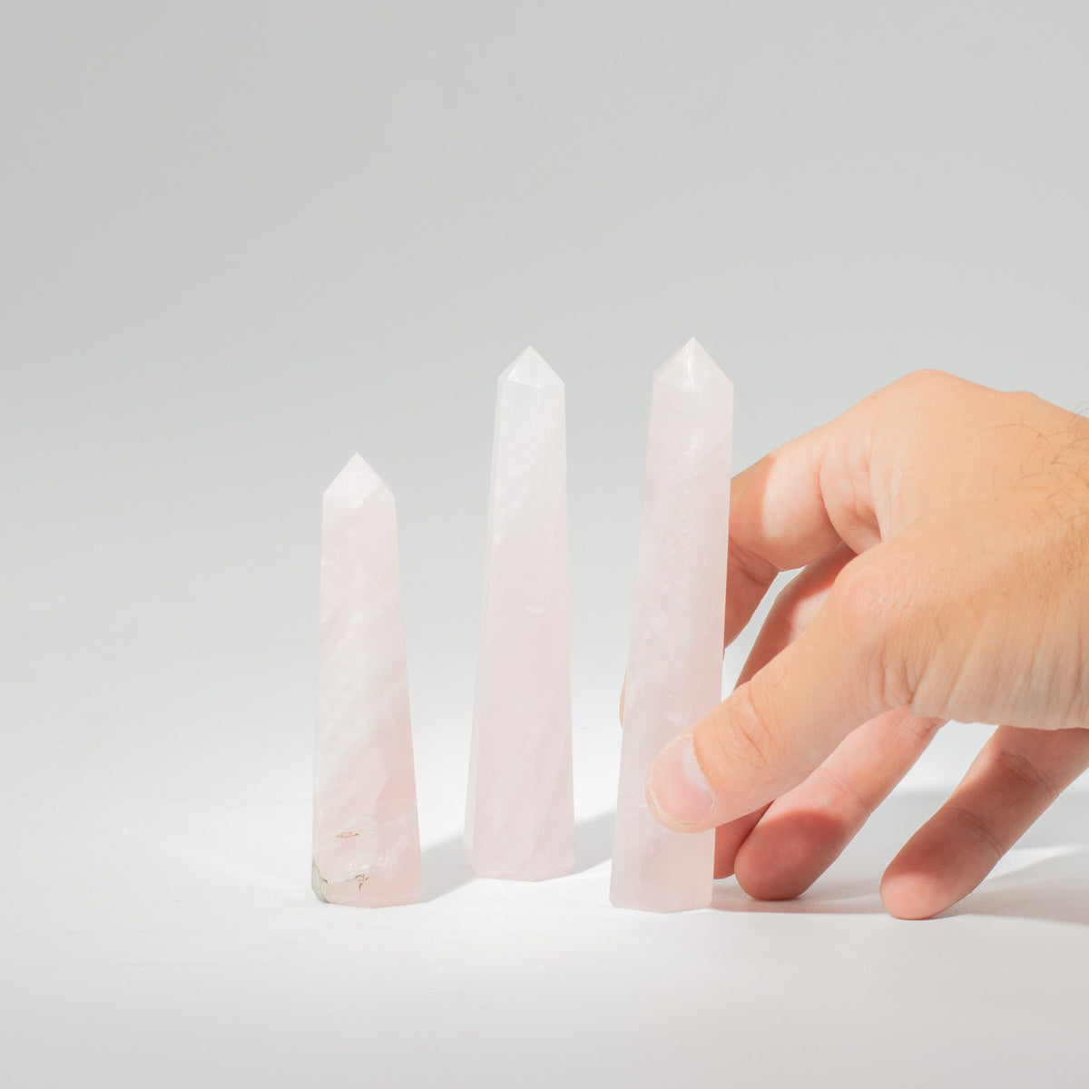 Polished rose quartz obelisk point, a six faced pale pink crystal tower - view 5