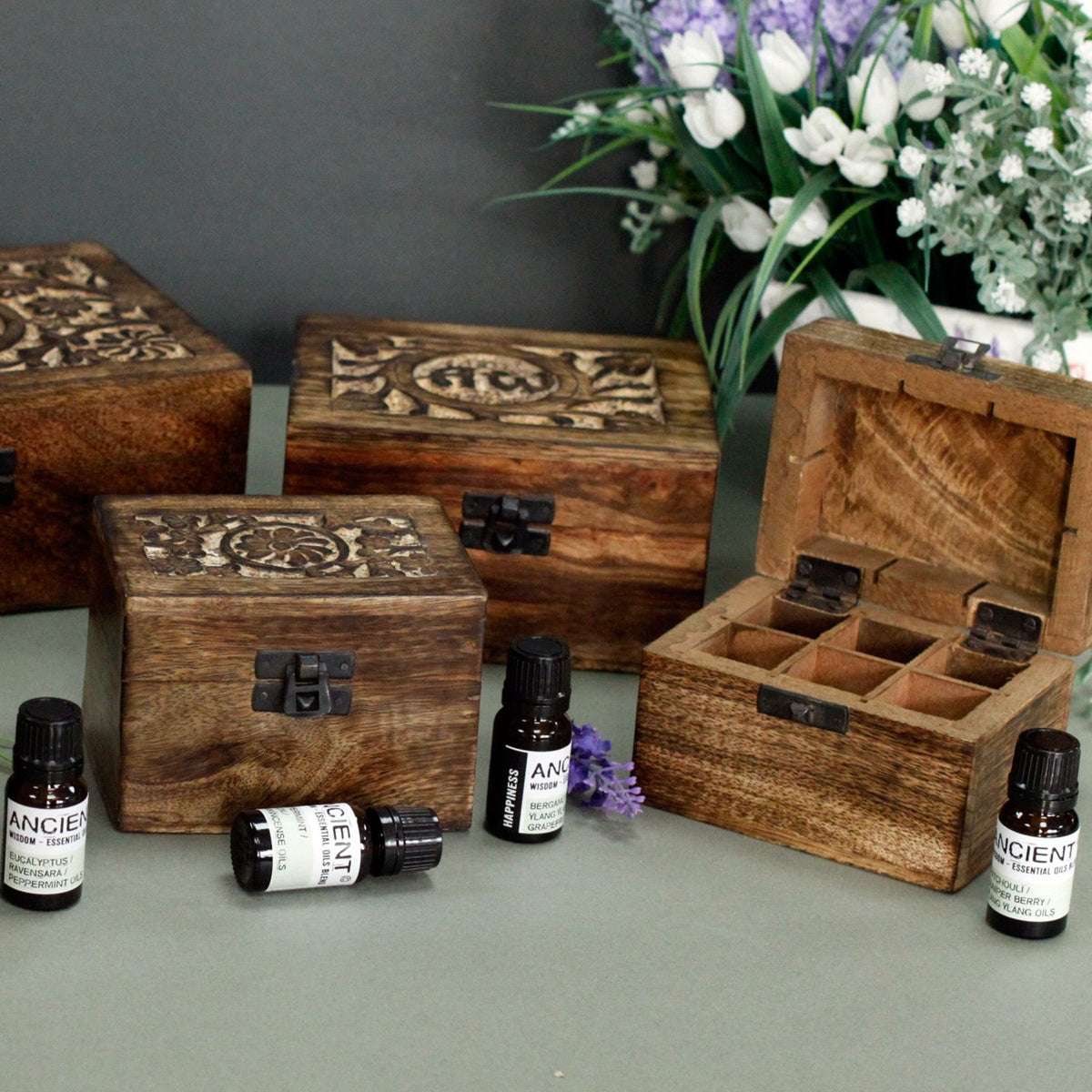 Carved mango wood box open to show the grid of 32 bottle compartments - view 5
