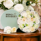 Round box packed with white and ivory soap roses, seen from above on cotton-rag paper - view 6
