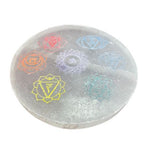 Medium round selenite charging plate with the seven chakra symbols in colour