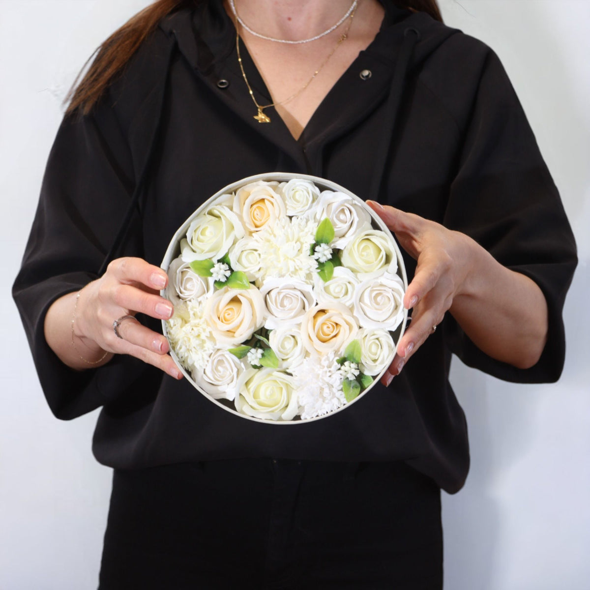 Round box packed with white and ivory soap roses, seen from above on cotton-rag paper - view 8