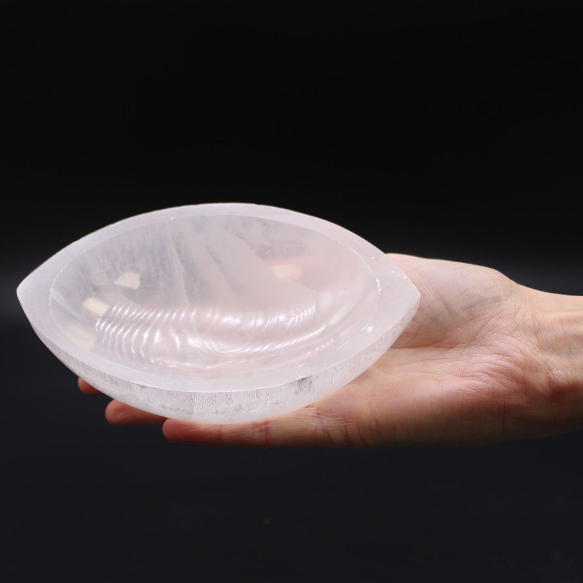 Pointed oval selenite bowl, polished inside with a raw white rim - view 5