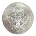 Medium round selenite charging plate engraved with a hamsa hand
