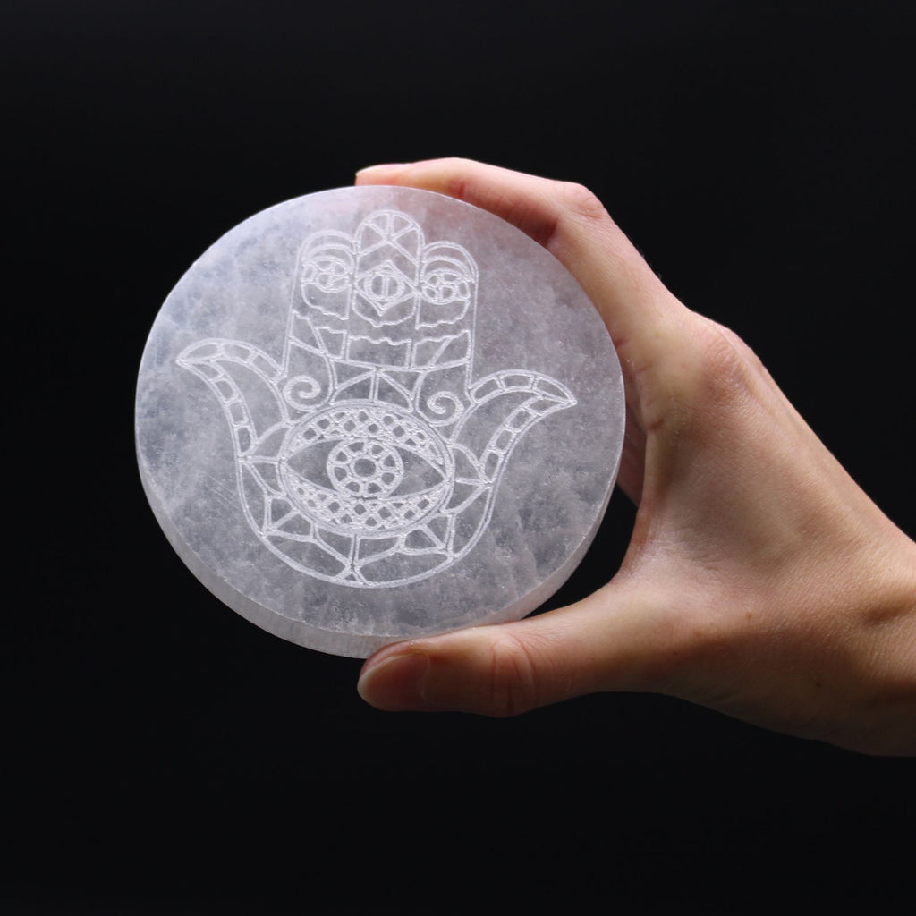 Medium round selenite charging plate engraved with a hamsa hand - view 2